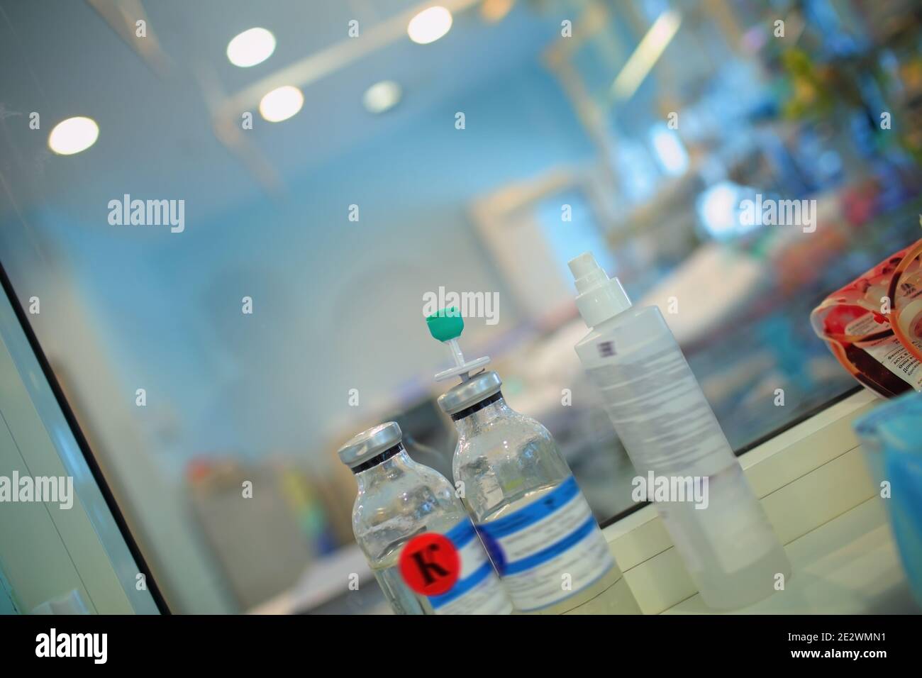 Solution bottles on the table in nurse`s area. Stock Photo